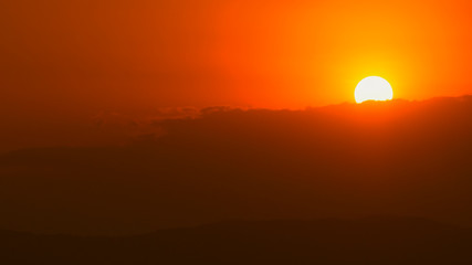 Fototapeta premium Natural sunset At dawn Sun beyond the horizon, warm horizon