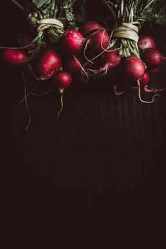 Close up of radishes on wooden table
