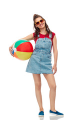 leisure, summer holidays and people concept - smiling teenage girl in sunglasses with beach ball over white background