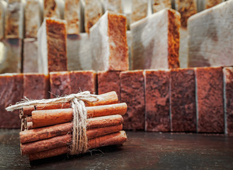 Bars of soap on a shop window. Cinnamon soap with natural cedar oil and herbal ingredients. Handmade natural cold process soap. Eco-friendly exfoliating soap for hair and body