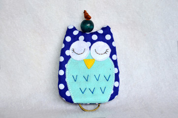 DIY handmade key cover owl doll pattern made from colorful fabric and leather and plastic beads in workshop thai style