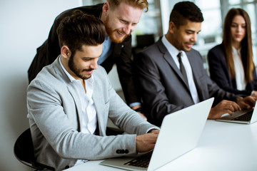 Group of business people sharing their ideas in the office
