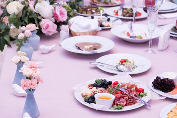 Served for banquet restaurant table with dishes, snack, cutlery, wine and water glasses, european food, selective focus