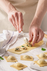 Male chef cooking ravioli. Healthy Italian food making.