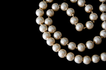 Pearls on black background