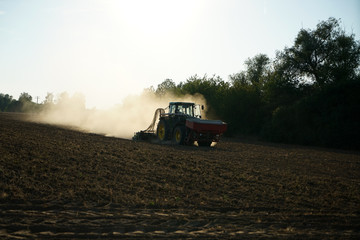 farmer was still working on a dusty field 