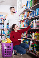 Couple choose some detergents