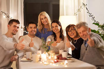 celebration, holidays and people concept - happy family having tea party at home