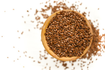 flax seed on white background,seeds,brown,healthy,food,ingredient,organic,isolated,cup,wood,dry,organic,breakfast.