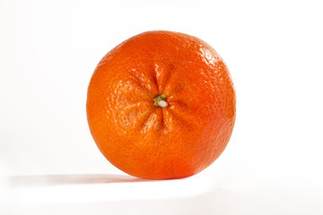 tangerine, tangerine slice on white background. tangerine on a colored background. tangerine on green and red background. falling, soaring, wet. Close up. macro mode. orange on white background