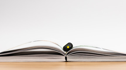 Book. Desk. Opened. Isolated. White. Marker