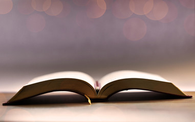 Book. Opened. Isolated. Bokeh. Desk. Wood. Pencil