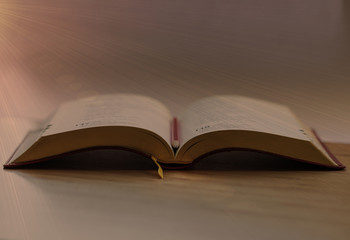 Book. Opened. Isolated. Desk. Bokeh. Wood. Pencil