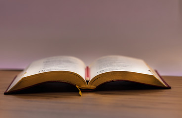 Book. Opened. Isolated. Desk. Wood. Pencil