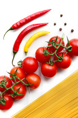 Spaghetti pasta with tomatoes, peppers isolated on white background. Italian food concept.