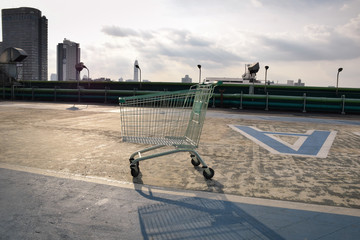 shopping Cart on rooftop with cloud and sky