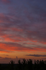 Fototapeta premium Landscape with dramatic light - beautiful golden sunset with saturated sky and clouds.