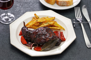 rabbit cooked in red wine with french fries
