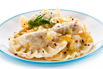 Dumplings - stuffed cheese noodles on white background