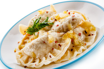 Dumplings - stuffed cheese noodles on white background