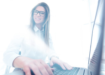 stylized photo. business woman sitting at her Desk