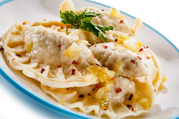 Dumplings - stuffed cheese noodles on white background