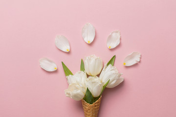 Flat-lay waffle cone with white flower blossom