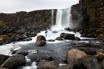 View of a Waterfall in Iceland on a Cloudy Autumn Day
