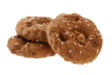 A bunch of homemade oatmeal cookies with nuts, chocolate and sesame. Isolated on white background.