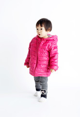 Cute asian little girl indoors on white background