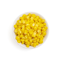 Bowl of sweet corn isolated on white background. top view