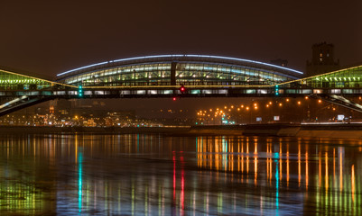 a beautiful bridge illuminated by a multitude of illuminations against the backdrop of the night...
