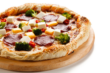 Pizza with salmi and feta cheese and vegetables on white background