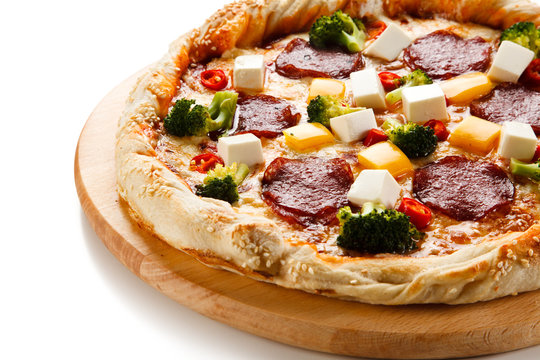 Pizza with salmi and feta cheese and vegetables on white background