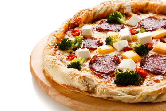 Pizza with salmi and feta cheese and vegetables on white background