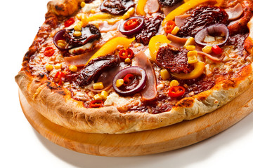 Pizza with ham, corn, mushrooms and dried tomatoes on white background
