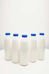 milk bottles on white table