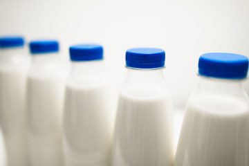 milk bottles on white