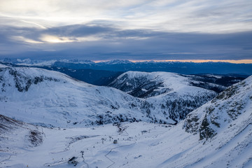 Fototapeta na wymiar Sunrise in Alps. Landscape with drone operator.