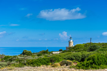 Fototapeta na wymiar Greece, Zakynthos, Beautiful north cape skinari lighthouse in green scenery