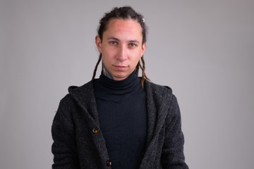 Obraz premium Portrait of young handsome man with dreadlocks