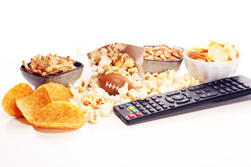 Chips, salty snacks, football on a table. Great for Bowl Game
