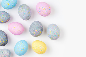 Background with pale pink, blue, yellow and gray Easter eggs. Compositions in pastel colors.  Easter concept