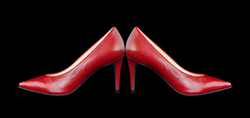 Red women's shoes on a black background