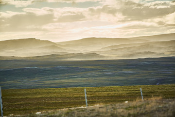 clouds and haze over mountain landscape