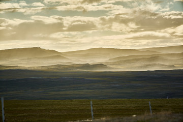 clouds and haze over mountain landscape
