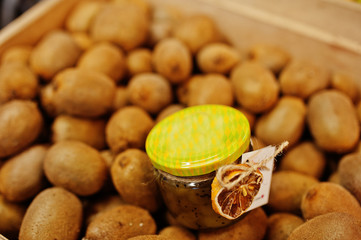 Hommemade jar with kiwi on the shelf of a supermarket or grocery store. Made with love.