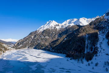 Fototapeta na wymiar Frozen lake Martel in South Tyrol