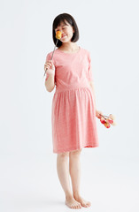 Pregnant women with flowers,White background in studio