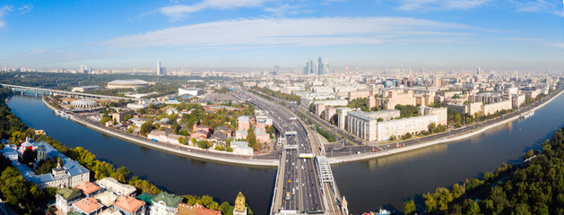 panorama high-rise buildings and transport of metropolis, Frunzenskaya Embankment and the Third Transport Ring, cars on multi-lane highways and road junction in Moscow.